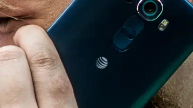 A man talking on an LG G4 smartphone