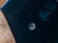 A man talking on an LG G4 smartphone