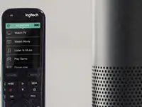 A home theater with an Amazon Echo and Logitech Harmony remote