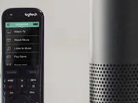 A home theater with an Amazon Echo and Logitech Harmony remote
