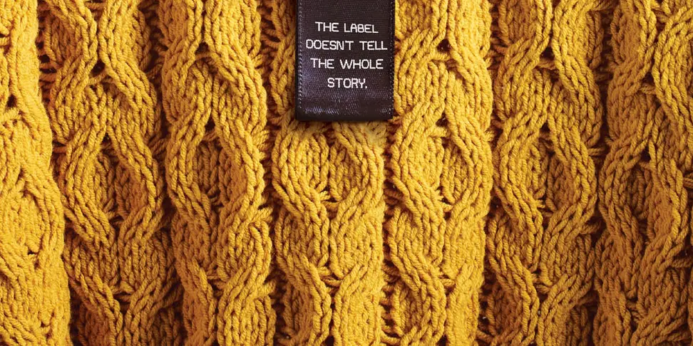 Clothing label stating "The Label Doesn't Tell the Whole Story"