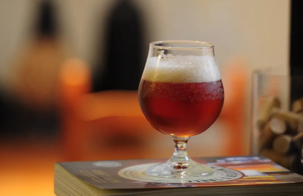 Belgian beer in a traditional curved glass