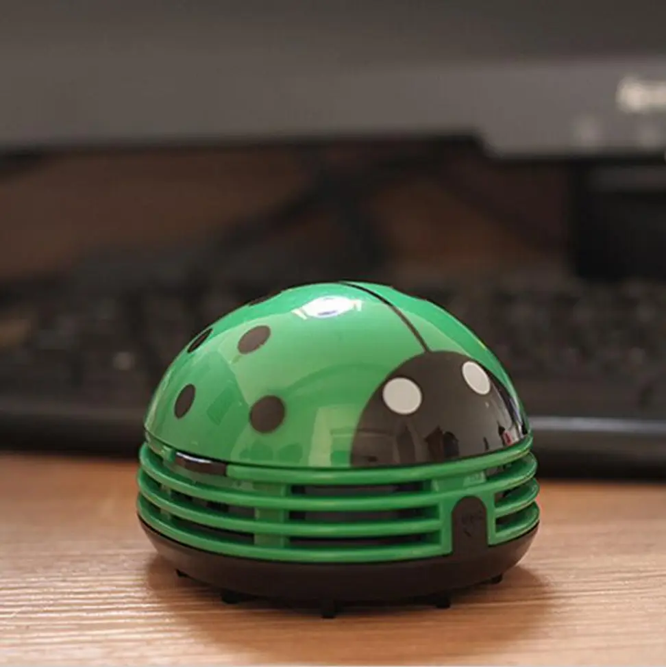 This adorable ladybug vacuum cleans tables and desks.