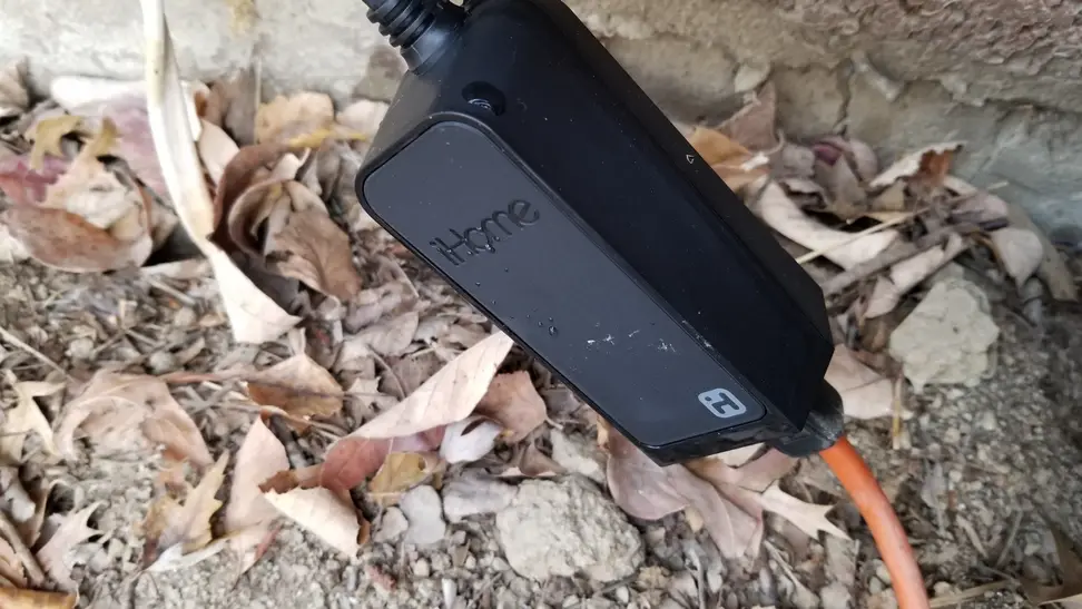 The Meross Outdoor Smart Plug plugged in outside