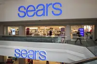 People shop at a Sears store on March 22, 2017 in Schaumburg, Illinois. Sears Holdings, the parent of Kmart and Sears, Roebuck, & Co., said there is 'substantial doubt' about the company's financial viability