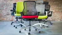 Several office chairs in a room
