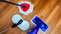 Three of the best mops we tested sit on a shiny hardwood floor