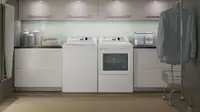The GE GTW680BSJWS top load washer and GTD65EBSJWS dryer.