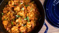 A pot full of homemade jambalaya with the lid removed, shot from above.