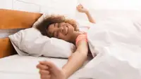 woman stretching after waking up