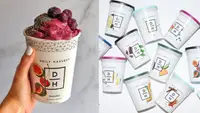 On left, hand holding a Daily Harvest smoothie. On right, several Daily Harvest smoothies on a white background.