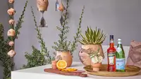 Trays, rain chains, and potted plants are great outdoor bar ideas