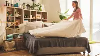 Woman making bed