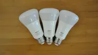 Three Philips Hue bulbs on table