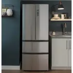 A close-up of a French-door refrigerator installed in a modern kitchen.