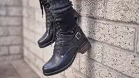 Crave boots from Taos dangling from a wall