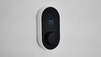 Wyze Thermostat against white wall