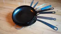 A stack of the best carbon steel pans Reviewed tested from Mauviel, BK Cookware, Blanc Creative, Matfer Bourgeat, De Buyer Mineral B, and more.