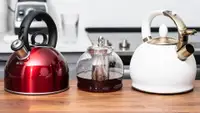 Three tea kettles, including the Cuisinart Aura, the Hiware glass kettle and the Susteas teapot, sit on a kitchen counter.