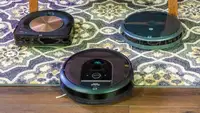The iRobot Roomba i7+, S9+, and 694 on carpet.