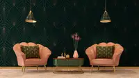 An Art Deco inspired sitting room with two pink armchairs and green accent table.