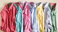 Pile of wrinkled dress shirts in a rainbow of colors