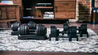 The Bowflex adjustable dumbbells and the Core Home Fitness dumbbells side by side.