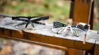 Oakley safety glasses and 3M safety glasses side by side.