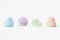 Four Goober candles lined up in a row