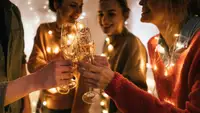Group of friends toasting with champagne flutes.