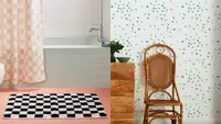 On left, black and white checkerboard bathmat in front of blue tiled retro bath tub. On left, white and green star wallpaper behind brown rattan chair.