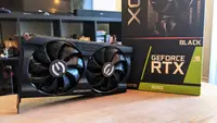 A desktop GPU next to its packaging box