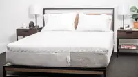 White mattress with pillows but without sheets.