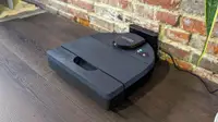 The Neato D8 in its charging dock.