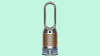Close up of a Dyson air purifier against a green background.