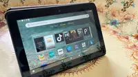 The Amazon Fire 7 tablet with the home menu displayed on the screen.