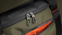Close-up of the hunter green Briggs & Riley ZDX large duffel bag