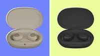 Cream and black pair of Jabra Enahnce Plus earbuds in their cases.
