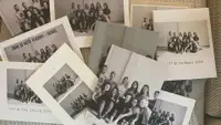 Several photo books strewn across a couch