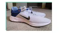 Side view of  Nike Revolution 6 FlyEase Next Nature on carpeted floor.