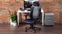 The SecretLab gaming chair in our labs in front of a desktop.