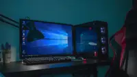 A gaming desktop pc setup complete with a gaming chair.