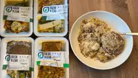 Four packaging of vegan Fresh N Lean meals next to a prepared meal in a bowl.