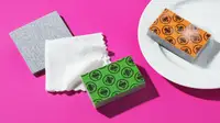 Product shot of multicolored Skura sponges and microfiber cloths.
