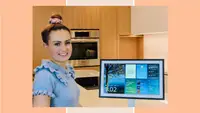 Molly Burke posing next to an Echo Show 15.