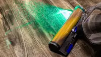 The Dyson Gen5outsize cleaning a hardwood floor with its Fluffy Optic head.
