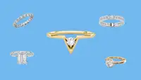 Five lab-grown diamond rings in front of a blue background.