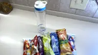 Cirkul water bottle and a variety of packaged flavor cartridges.