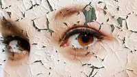Close up person's face with the paint chipping away like dry, flakey skin