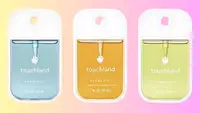 Three Touchland hand sanitizers on a colored background